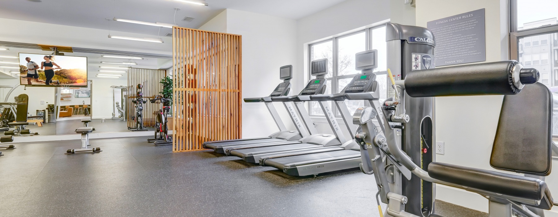 Fitness Room with white walls and various equipment