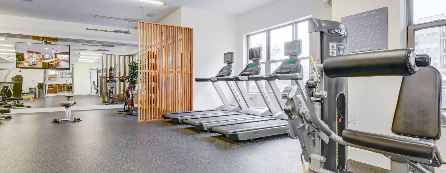 Fitness Room with white walls and various equipment